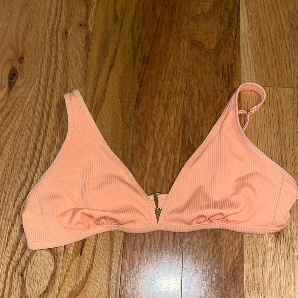 Peach colored bikini top.
